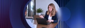 Kelly Hood speaking to clients in office